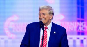 President-elect Donald Trump speaks at AmericaFest, Sunday, Dec. 22, 2024, in Phoenix. (AP Photo/Rick Scuteri)